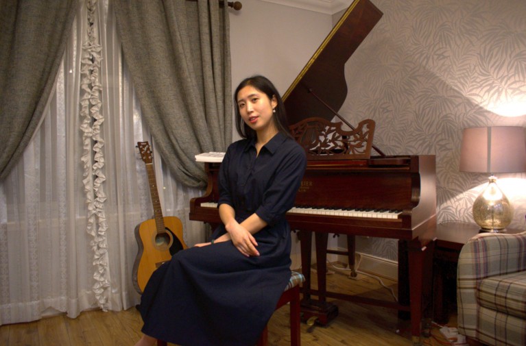 Cecilia Hong sat at her piano.