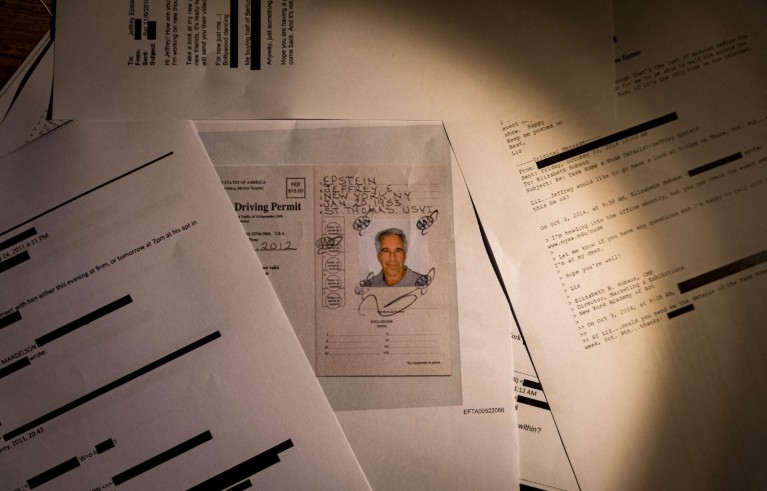 Jeffrey Epstein files and documents showing Jeffrey Epstein, that s seen photographed on a desk.