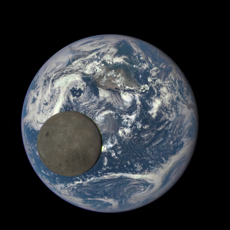 Animation still image of far side of the moon, illuminated by the Sun, in front of Earth.