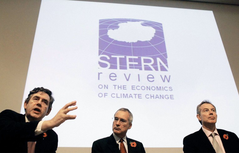 Britain's Chancellor of the Exchequer Gordon Brown, left, speaks at the Stern review into climate change as Prime Minister Tony Blair, right, and Nicholas Stern look on, at the Royal Society in London.