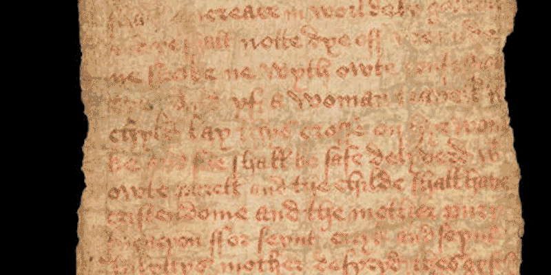 An animated sequence moving down a length of a stained birth scroll with prayers and invocations to Saints Quiricus and Julitta.