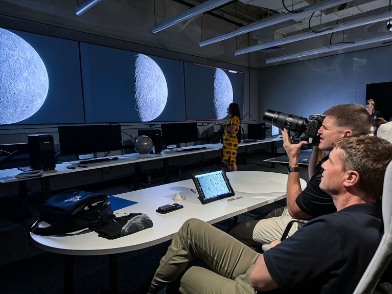 The Artemis II astronauts are trained to take lunar photos using a camera and images on screens in front of them.