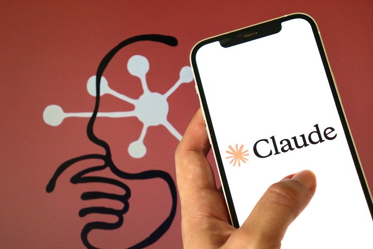 A close-up view of a hand holding a smartphone, with the Claude logo on the screen, and a graphic of an amorphic thinking head in the background.