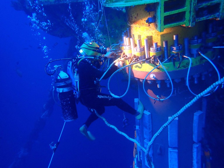 Scuba divers confirming the underwater structure of Deep Sea No. 1.