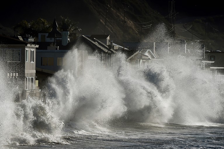 Powerful waves driven by a super El Niño weather pattern batter homes along the Pacific coastline in 2016.