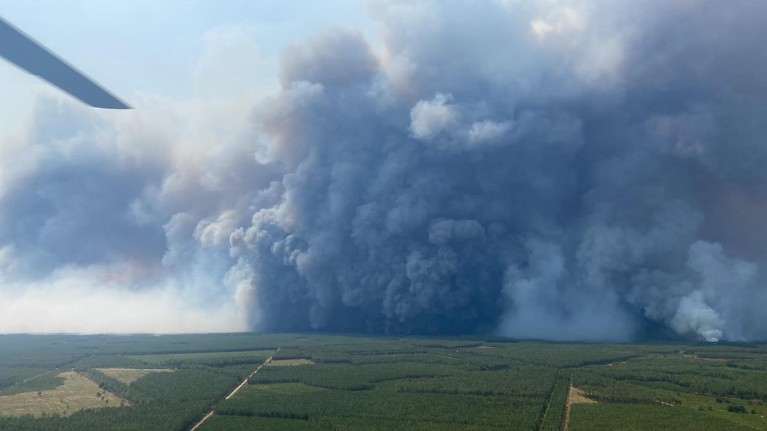 Photo provided by Fire and Rescue Service 22 (SDIS33) shows a pyrocumulonimbus cloud, formed by a large wildfire, as seen from a firefighting helicopter over Saumos, France.