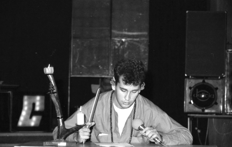 A black and white photo of Čubomir Tomaszka preparing for a lecture in his youth.