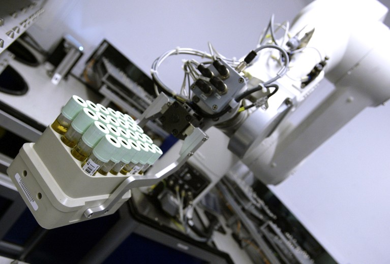 A robotic arm processes a blood sample at the UK Biobank laboratory.