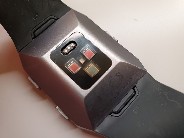Close-up view of the back of the smartwatch on a plain background.