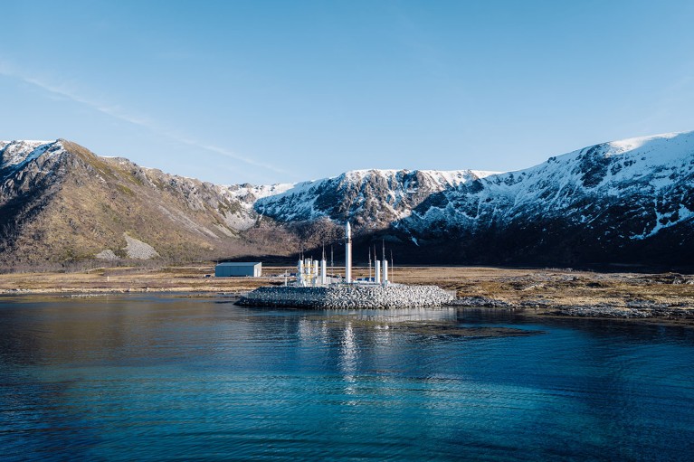 The Spectrum rocket sits on a launch pad at Norway's Andøya Spaceport, surrounded by snow-capped mountains.