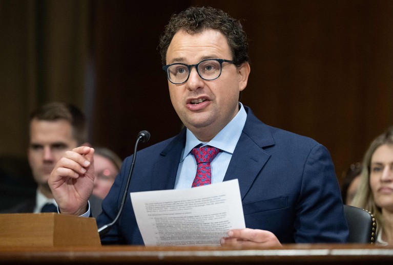 Dario Amodei, CEO of Anthropic, taking the stand and testifying during a US Senate.