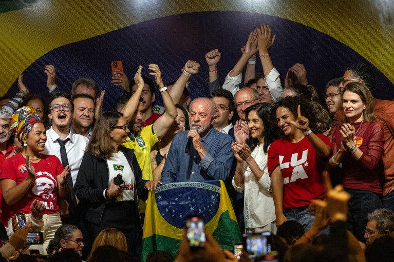 Luiz Inacio Lula da Silva, Brazil's president, addresses his supporters while on a small podium surrounded by a celebration of his reelection.