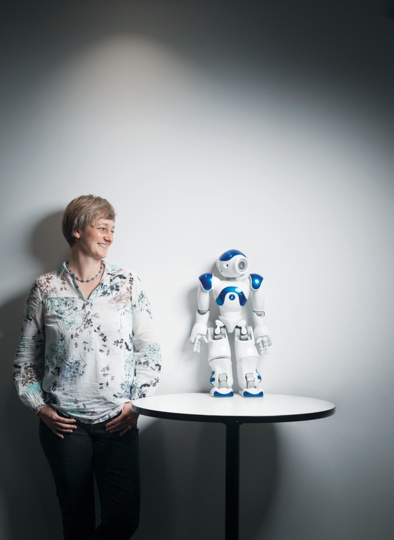 Associate Professor Sonja Pedell with robot designed to help elderly users.
