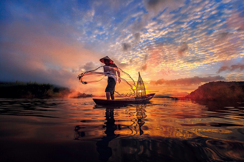 Man fishing on the Mekong River