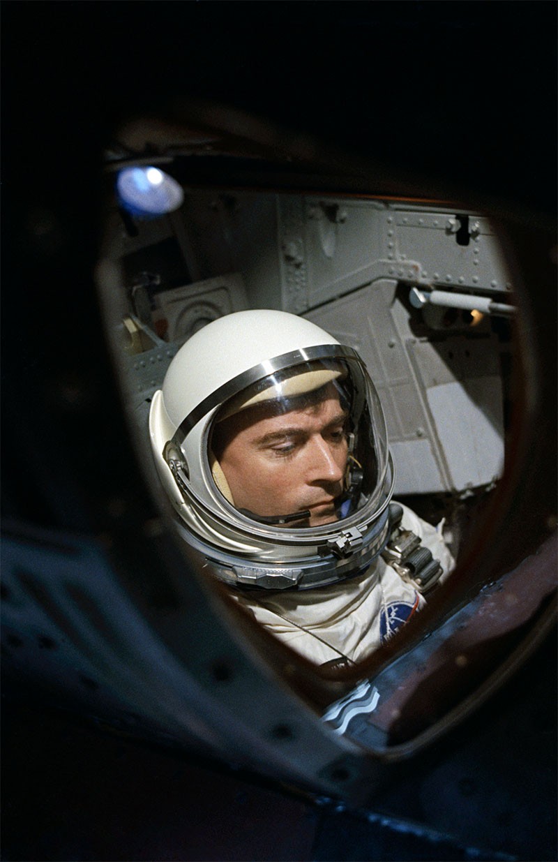 Astronaut John W. Young through spacecraft window