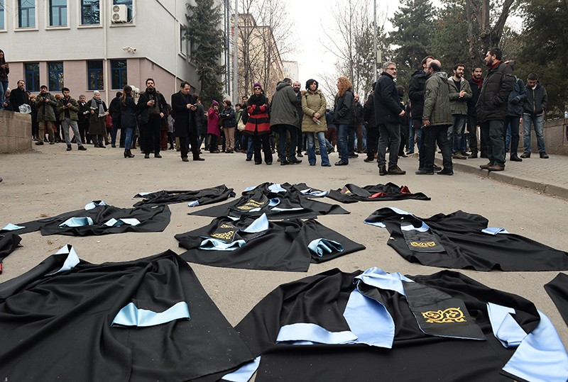 Academics lay down their gowns during a protest against the dismissal of academics in Turkey, 2017.