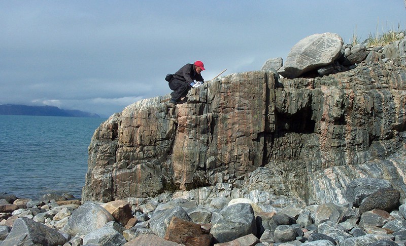 BIll Glassley examining rocks in Greenland