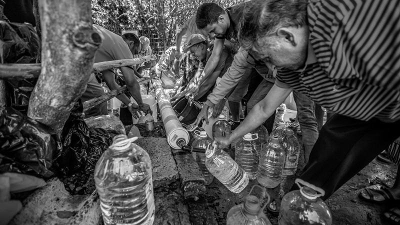 Cape Town residents queue to refill water bottles