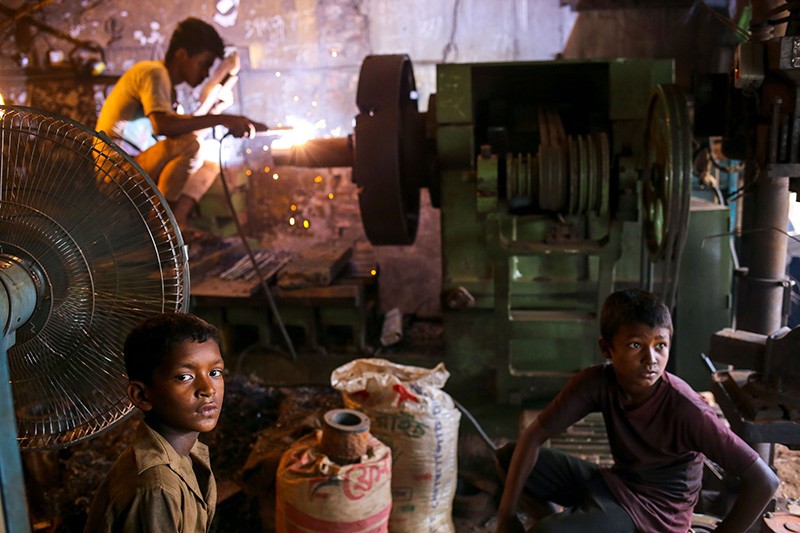 Boys working in a shipyard in Bangladesh