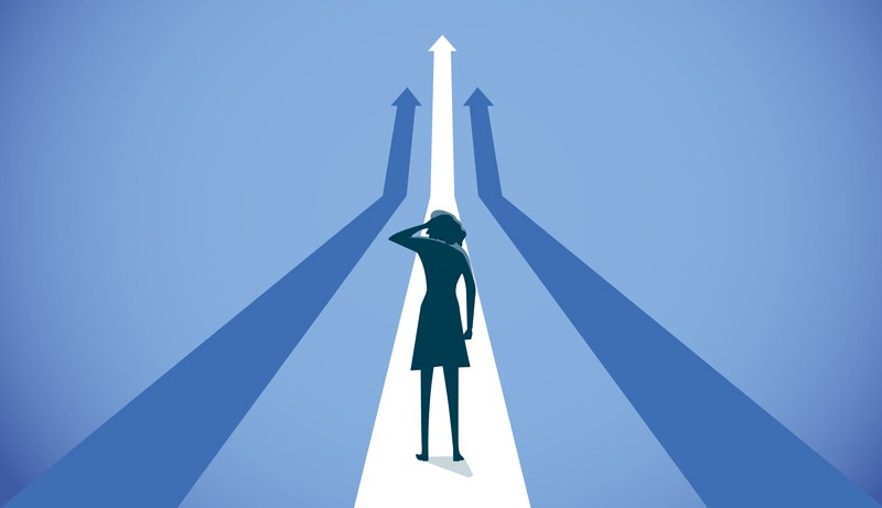 Cartoon image of woman's silhouette, gazing into the distance at several possible paths