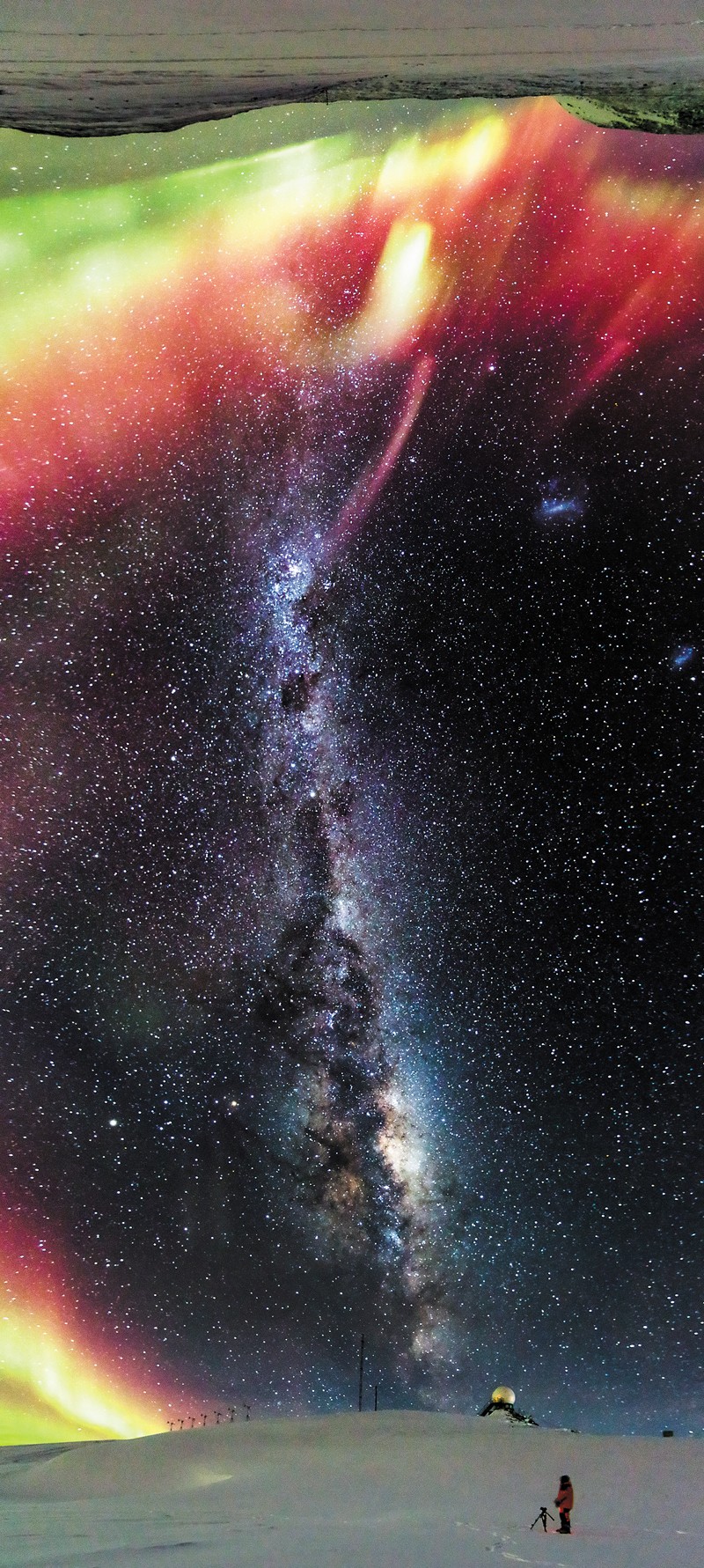 Panoramic view of an aurora and the Milky Way