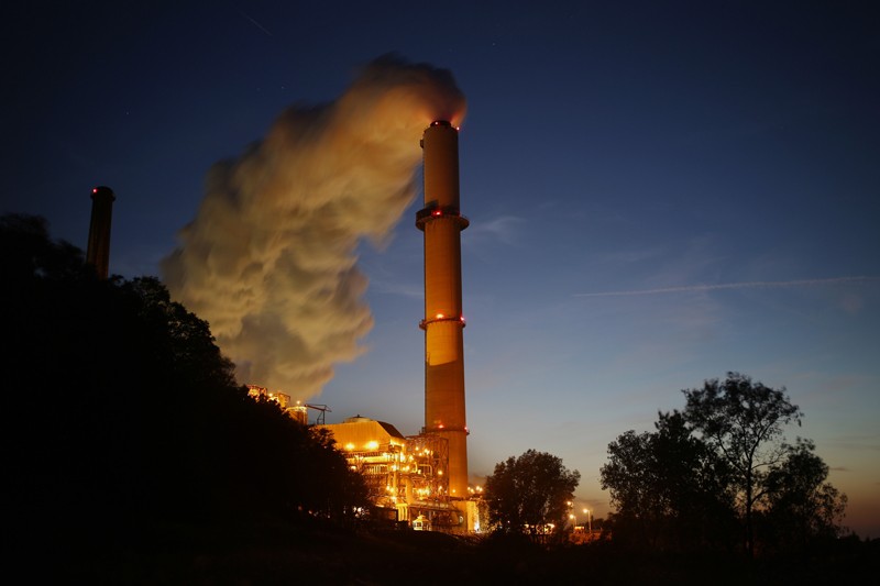 Emissions rise from a coal-fired power station at night