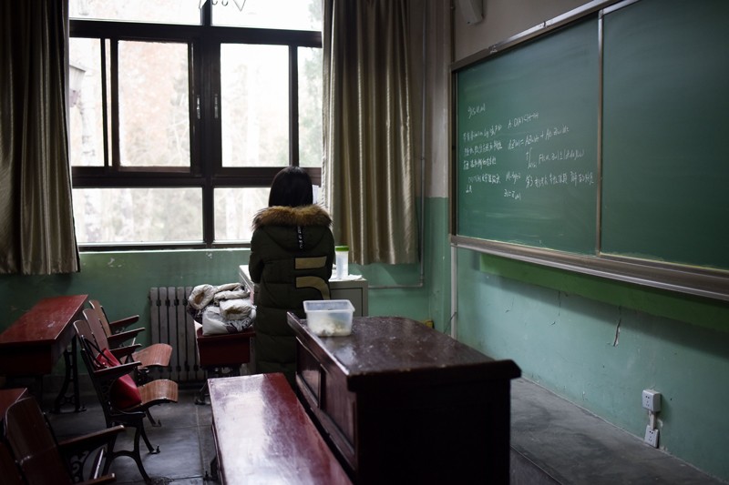 A female student in a classroom at Beihang University in Beijing.