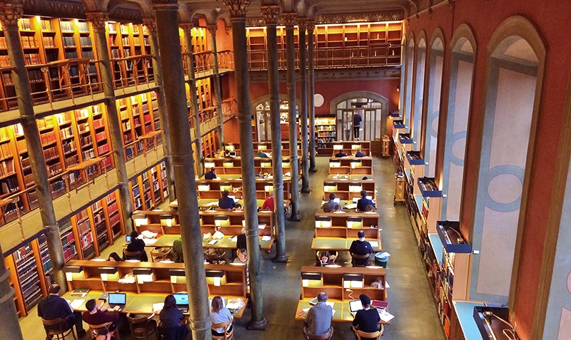 Aerial view of people reading at desks at the National Library of Sweden