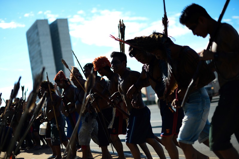 Indigenous tribespeople protest the construction of a hydroelectric plant in the Amazon