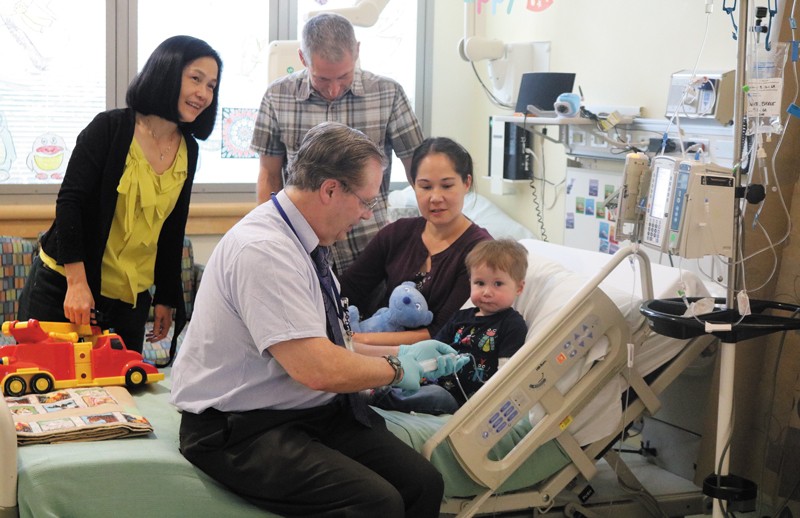 Patient advocate Anne Klein in hospital with her son Everett