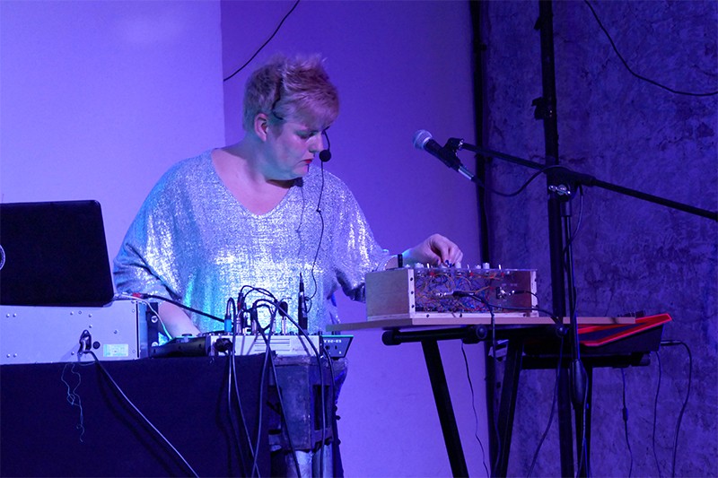 Jo Thomas uses a mini oramics machine on stage during a set