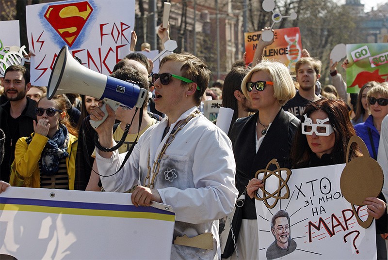 People carry pro-science placards during a March for Science rally in Kiev, Ukraine, in April 2018.