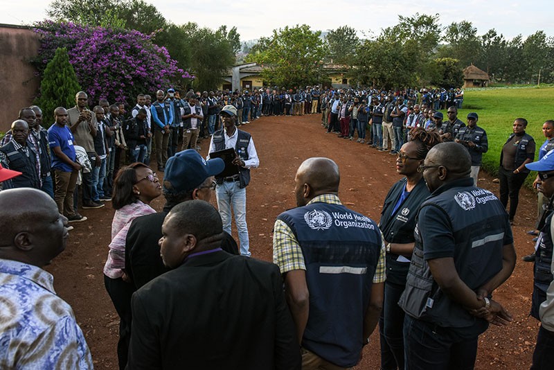 WHO staff members talking to people in Butembo, DRC