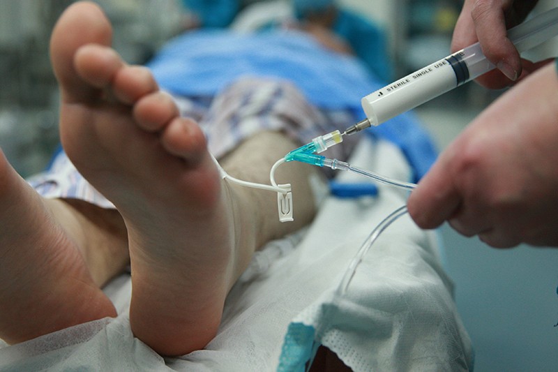 A patient being anaesthetized in an operating room in China