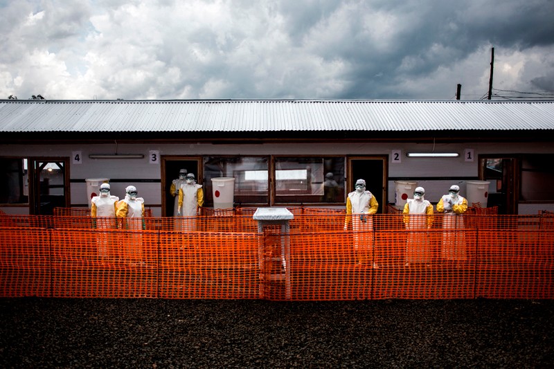 Health workers are seen inside the red zone of an Ebola treatment centre in Bunia, Democratic Republic of the Congo