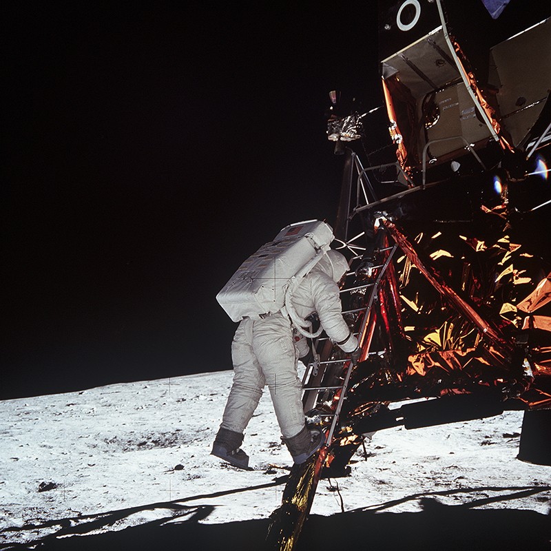 Astronaut Edwin E. Aldrin Jr descends the steps of the Lunar Module on the moon, July 20, 1969