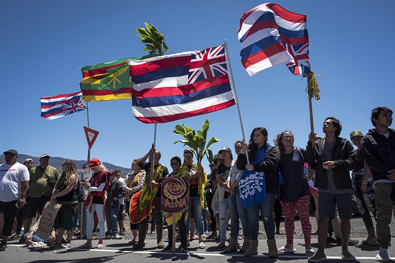 Hundreds of demonstrators gathered by the Mauna Kea Access Road in Hawaii