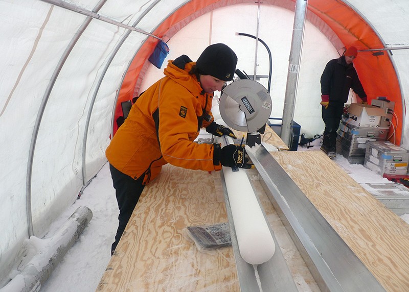 Liz Thomas measures an ice core in Antarctica
