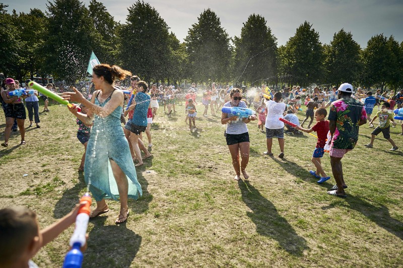 People cool off as they enjoy a water fight in the Netherlands, on July 24, 2019