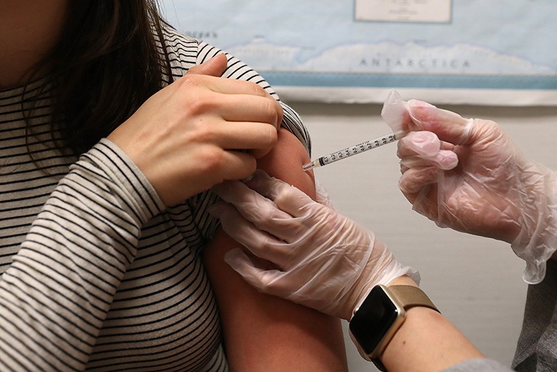 A patient receives a flu shot at a pharmacy on January 22, 2018 in San Francisco