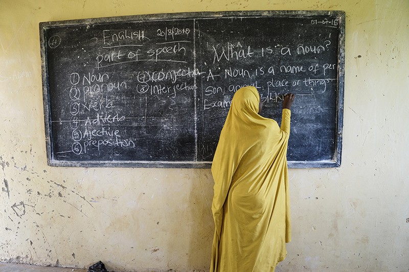 A Mentor from the Centre for Girls Education gives an English lesson at a safe space club for girls in northern NIgeria