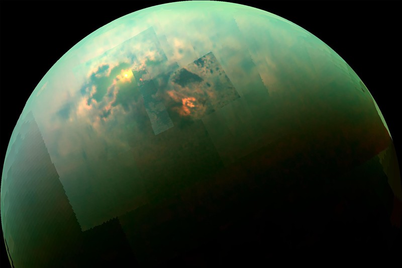 Colour mosaic from NASA's Cassini spacecraft shows the sun glinting off of Titan's north polar seas