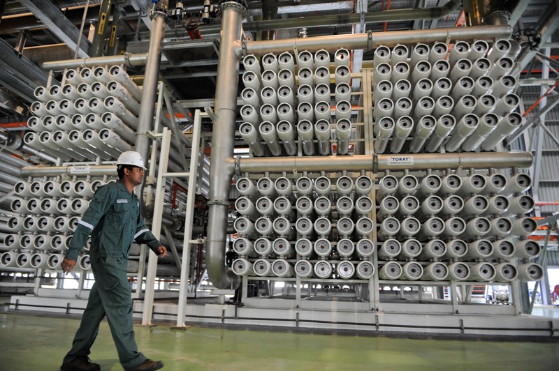 An engineer makes a routine check of the NEWater membrane process water treatment plant in Singapore