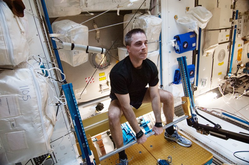 NASA astronaut Chris Cassidy works out on the advanced Resistive Exercise Device (aRED) of the International Space Station