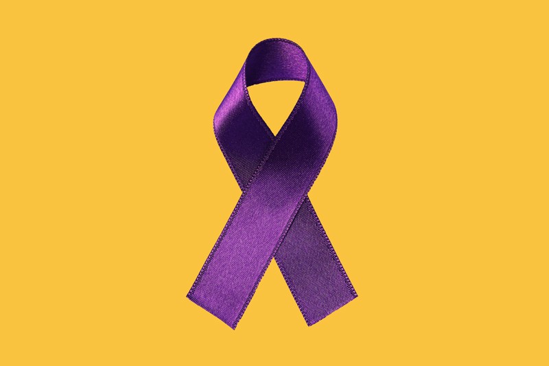 Purple ribbon on yellow background