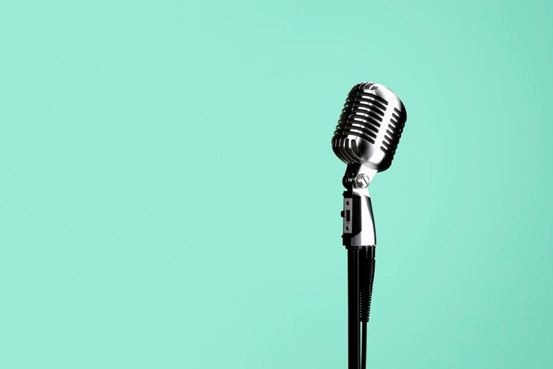 Freestanding microphone on green background