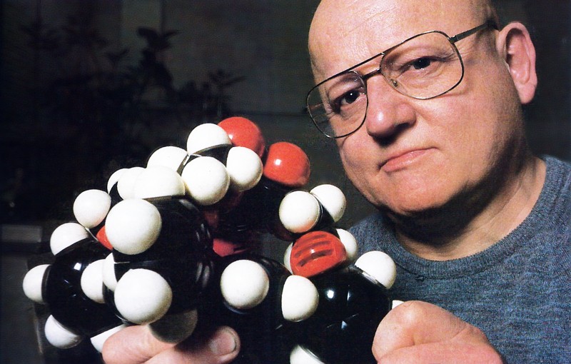 Chemist Jack Baldwin holding a molecular model