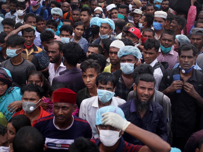 People get into an overcrowded ferry to get home to celebrate Eid-Ul-Fitr, Bangladesh.