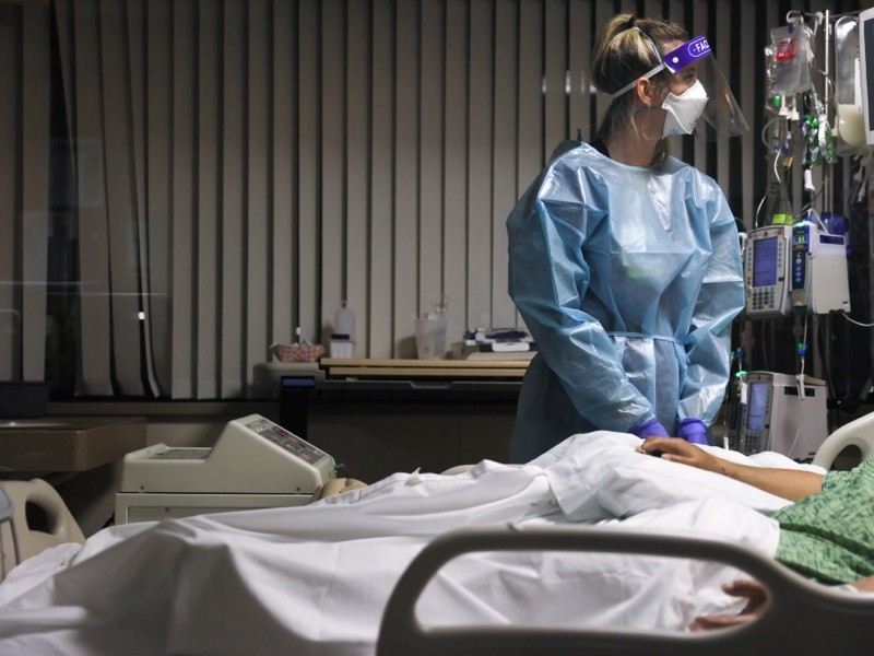 Tricia Cook cares for a COVID-19 patient in the Intensive Care Unit (ICU), California.