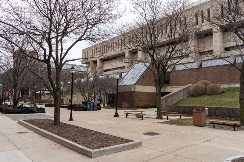 An empty plaza in front of a university building